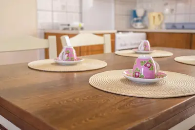 a kitchen counter with three plates and bowls on them at Mamis Studio in Kissamos