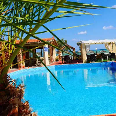 a large blue swimming pool in a resort at Stavros Villas&Apartments in Gerani Chanion