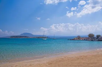 a beach with some boats in the water at Feels like home in Chania Town