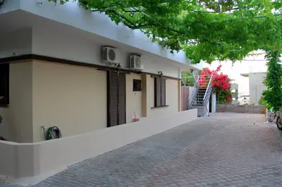 a building with two air conditioners on the side of it at Your Home in Kato Daratso