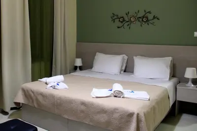 a hotel room with a bed with towels on it at Your Home in Kato Daratso
