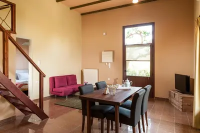 a dining room with a table and chairs at Filio House in Stalos