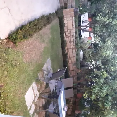 an aerial view of a house with a yard at Cactus in Nopíyia