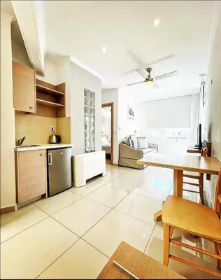 a kitchen with a table and a dining room at Pal Beach in Palaiochóra