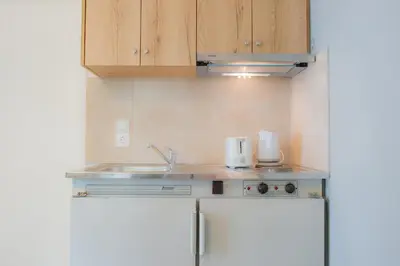 a kitchen with a sink and a counter top at Stellar Apartments II in Plataniás
