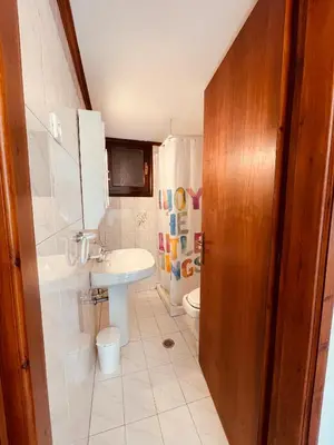 a bathroom with a sink and a toilet at Brina's House in Kissamos