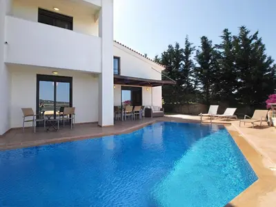 a swimming pool in front of a house at Villa Rotunda A in Kolymvari