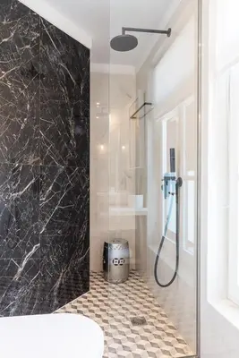 a bathroom with a shower with a glass door at Alexandra's Lighthouse View in Chania Town