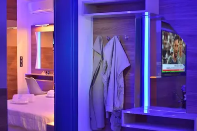 a room with a bedroom with a bed and a tv at Villa Zafyra in Kissamos