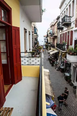 a view of a street from a balcony of a building at Green Door Apartment in Chania Town
