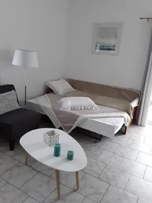 a living room with a couch and a table at Marianos Apartments in Kissamos