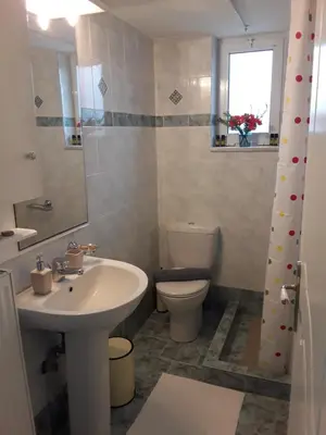 a bathroom with a sink and a toilet at Marianos Apartments in Kissamos