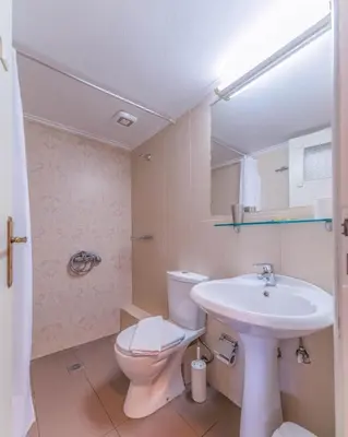 a bathroom with a toilet and a sink at Kalamaki Mare Suites in Kalamaki Chanion