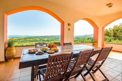 a dining room with a table and chairs at Villa Seli in Gerani Chanion