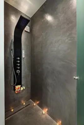a bathroom with a hair dryer in a wall with lights at Solar Apartments by Amara Living in Agia Marina Nea Kydonias