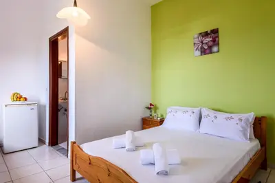 a bedroom with a bed with towels on it at Antonis Studio in Sfinárion