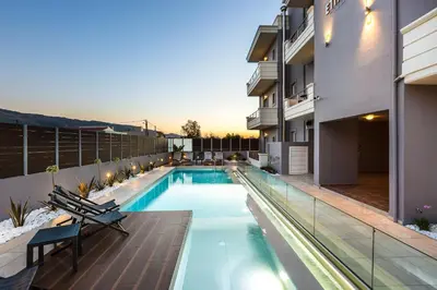 a swimming pool in the backyard of a house at Ethereal Apartments Chania in Souda
