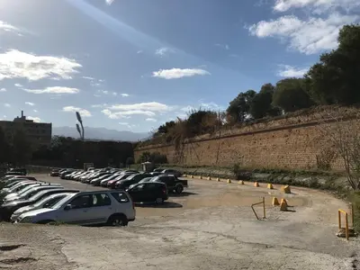 a bunch of cars parked in a parking lot at East Seafront Suite in Chania Town