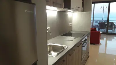a kitchen with a sink and a counter top at Casa Bella Deluxe Apartments in Palaiochóra