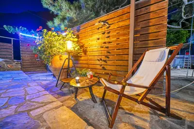 a chair and a table on a patio at 