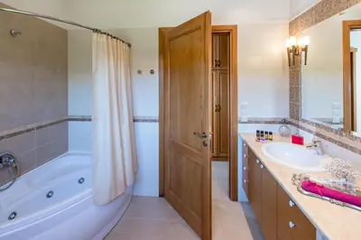 a bathroom with a tub and a sink at Villa Anerocurù by Chania city in Chania Town