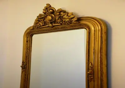 a mirror with a gold frame on a wall at The Manor House in the Old Town in Chania Town