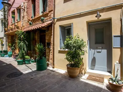 a group of potted plants in front of a building at Casa Minaretto in Chania Town