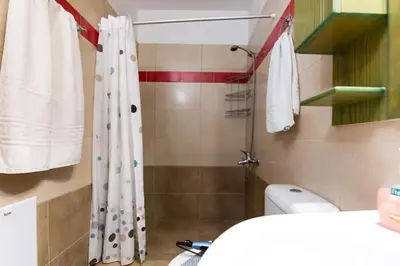 a bathroom with a shower and a toilet at Nikis Apartments Kisamos in Drapaniás