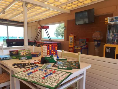 a table with games on it in a room at Maleme Mare in Maleme
