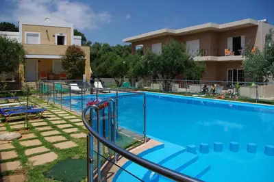 a large swimming pool in front of a house at Elea in Kato Daratso