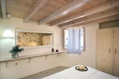 a living room with a table and a window at Mousa Thalia in Kissamos