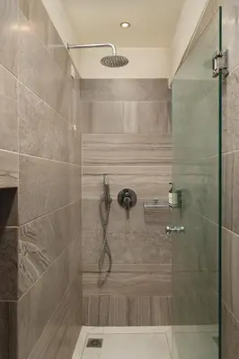 a bathroom with a shower with a glass door at Elia Palazzo Hotel in Chania Town
