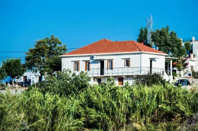 a white house with a red roof at Villa Alexandra in Kissamos