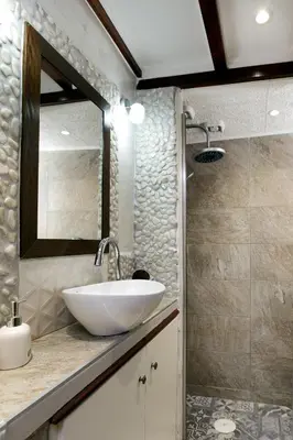 a bathroom with a sink and a mirror at Sali Chelidonaki boutique suite in Chania Town