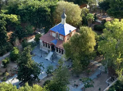 an overhead view of a church with a blue roof at Cozy one-bedroom apartment in Halepa, Chania in Chania Town