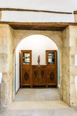 an archway leading into a room with wooden doors at Aelios Design Hotel in Chania Town