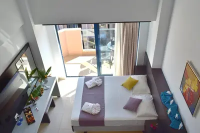 an overhead view of a room with a bed and a balcony at Galini Sea View in Agia Marina Nea Kydonias
