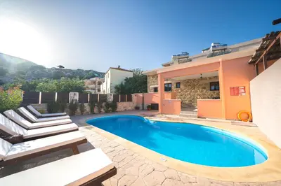 a swimming pool in the backyard of a house at Nemesis in Plátanos