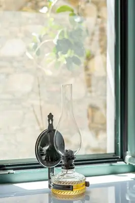 a glass jar sitting on a window sill at Dream House in Perivólia