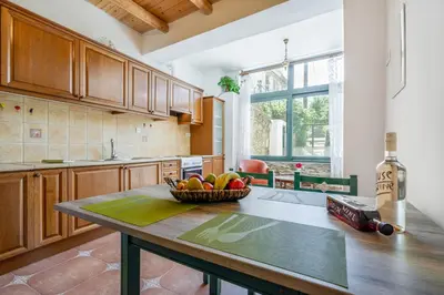 a kitchen with a bowl of fruit on a table at Dream House in Perivólia