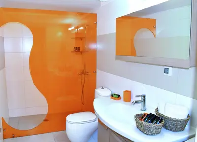 a bathroom with a sink and a toilet at Modi Home in Vrísai