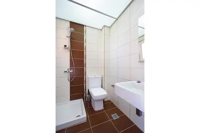 a bathroom with a toilet and a sink at Geas House Thalassa in Kolymvari
