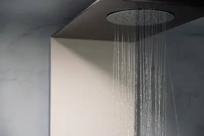 a shower head with a drop of water hanging from it at Nine in Chania Town