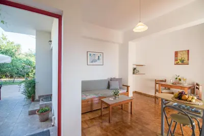 a living room with a couch and a table at Christiana Apartments in Gerani Chanion