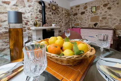 a basket of fruit sitting on top of a table at Μylos in Kissamos