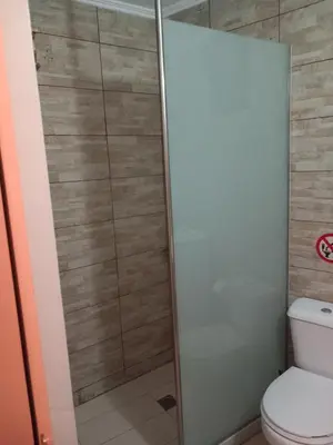a shower in a bathroom with a toilet at Μylos in Kissamos