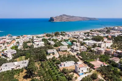 an aerial view of a city and the ocean at Villa Rebecca in Agia Marina Nea Kydonias