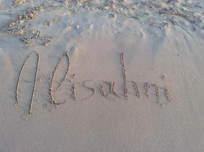 a word written in the sand on a beach at Alisahni Villa & Suite in Kato Daratso