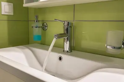a sink with a water faucet in a bathroom at Alisahni Villa & Suite in Kato Daratso