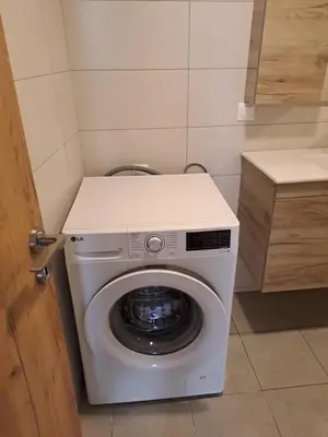a washer and dryer in a small room at Parthenon Hotel in Souda